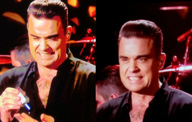 Robbie Williams washes hands