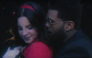 Watch Lana Del Rey and The Weeknd canoodle on the Hollywood sign in 'Lust For Life' video