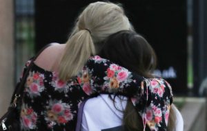 A mother and daughter leave the Ariana Grande concert