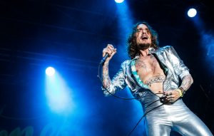 The Darkness tell us about their 'young blonde' new album 'Pinewood Smile' (and Brexit and Guns N' Roses)