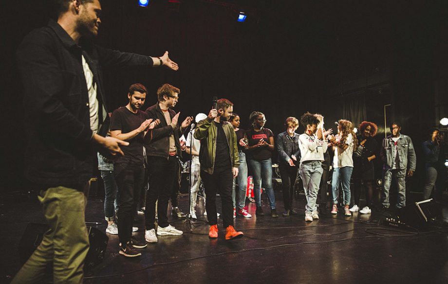 Everything Everything and participants on stage in Manchester