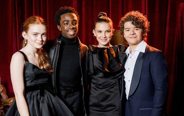Millie Bobby Brown with the cast of 'Stranger Things' at the Golden Globes 2018