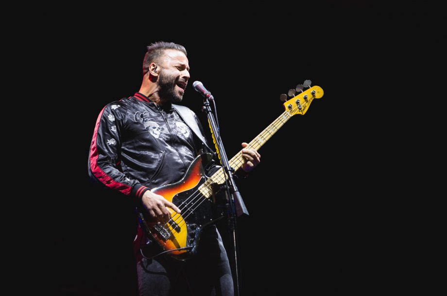 Muse bassist Chris Wolstenholme loves a singsong