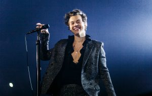 Harry Styles adorns his guitar with 'End Gun Violence' stickers while on tour in America