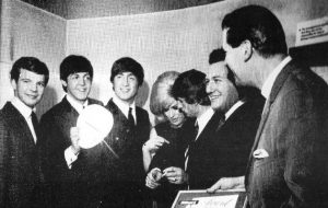Vee (far left) with The Beatles
