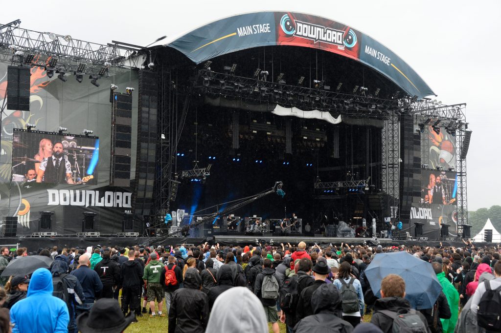 People gather around the main stage during the hard rock music Download festival in Paris on June 12, 2016. Download Festival gathers in the UK since 2003 fans of heavy guitars and powerful rock, but this year another edition is staged in Paris from June 10 to June 12, 2016. / AFP / BERTRAND GUAY (Photo credit should read BERTRAND GUAY/AFP/Getty Images)