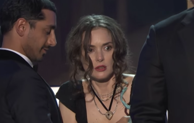 Winona Ryder listens to Stranger Things co-star David Harbour's speech at the SAG Awards 2017