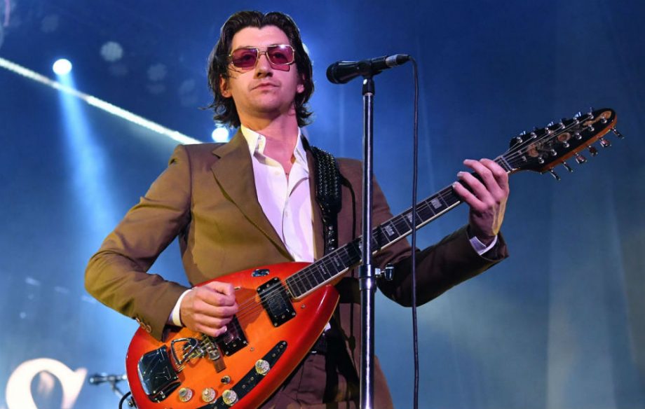Alex Turner poses with six year old superfan