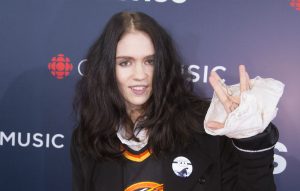 Online searches for the meaning of the word 'capitulate' spike by 500 percent thanks to Grimes' new song 'We Appreciate Power'
