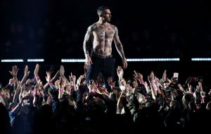 Maroon 5's Adam Levine sparks gender disparity complaints to the FCC after showing his nipples during Super Bowl halftime show